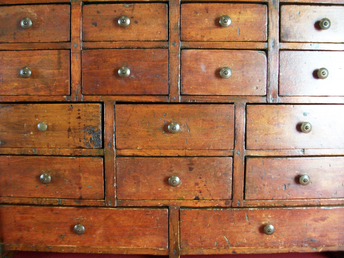 A Collectors cabinet of 16 Drawers dated 1910